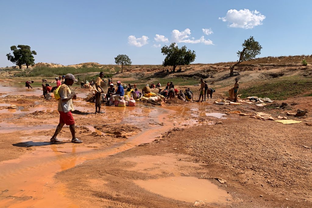 The Wild west of Madagascar is still experiencing a Sapphire rush, these people are panning for them in a roadside riverbed (image by Mike Watson)