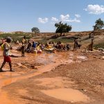 The Wild west of Madagascar is still experiencing a Sapphire rush, these people are panning for them in a roadside riverbed (image by Mike Watson)