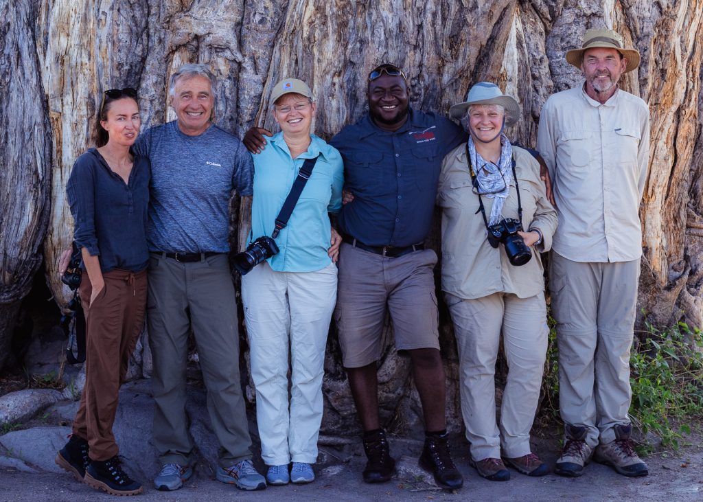 Our 2022 ‘Botswana Wildlife Spectacular’ tour group, in front of a huge Baobab tree (image by Gin Wilde)