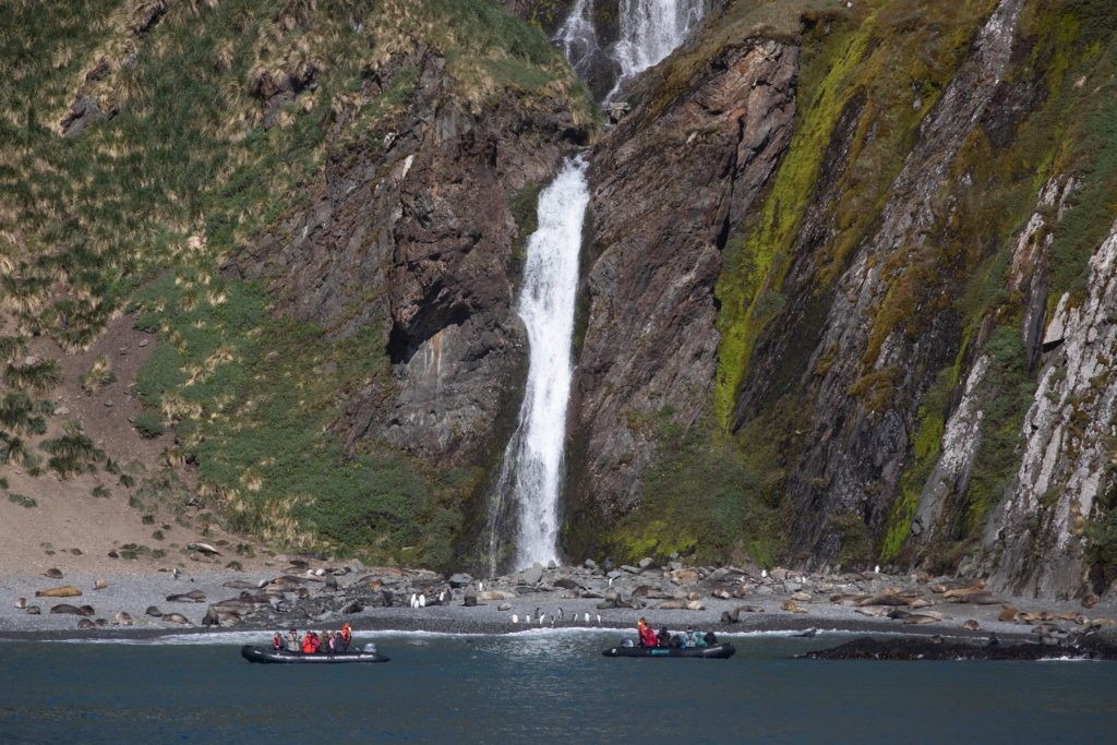 Zodiac cruising past the incredible waterfall at Hercules Bay (image by Inger Vandyke)