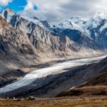 The Drang Drung Glacier as viewed from 14,400 ft Pensi La Pass. Signs of change at the bottom of the image, as construction of the Zanskar road continues (image by Julie-Anne Davies)