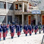 Young Islamic school children, lined up from tallest to shortest, begin their day with the Muslim Call to Prayer at Parkachik (image by Julie-Anne Davies)