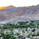 Leh from high above town at the Leh Palace, looking across to the Shanti Stupa at sunset. The Stupa was built in 1985 to promote world peace and commemorate 2500 years of Buddhism (image by Julie-Anne Davies)