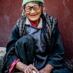 Local Woman crushing apricots in Takmachik (image by Julie-Anne Davies)
