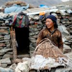 Padma Tsolmo, nomadic goat herder, outside her stone Nomad ‘home’ (image by Julie-Anne Davies)