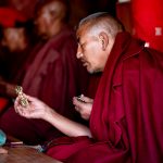 A Phugtal monk deep in prayer during puja (image by Julie-Anne Davies)