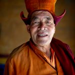 Tsering Wang Chuk, a Karsha monk, smiling inside the Monastery (image by Julie-Anne Davies)