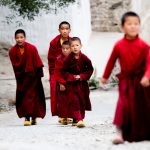 Young monks arriving for early morning puja at Karsha Monastery (image by Julie-Anne Davies)