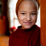 Serene portrait of a pretty Zangla nun (image by Julie-Anne Davies)