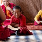 Young Buddhist monks learn to read Tibetan scripture in their monastery classroom at Karsha (image by Julie-Anne Davies)