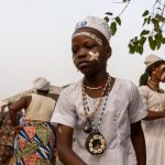 Young girls line up to perform Atigali, another voodoo ceremony of healing (image by Inger Vandyke)