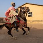 The spectacular display of Batonu horsemen on the streets of Parakou, Benin (image by Inger Vandyke)