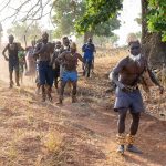 A group of Otamari men arrive to celebrate Dikpantri, or initiation of young warriors to elder status (image by Inger Vandyke)