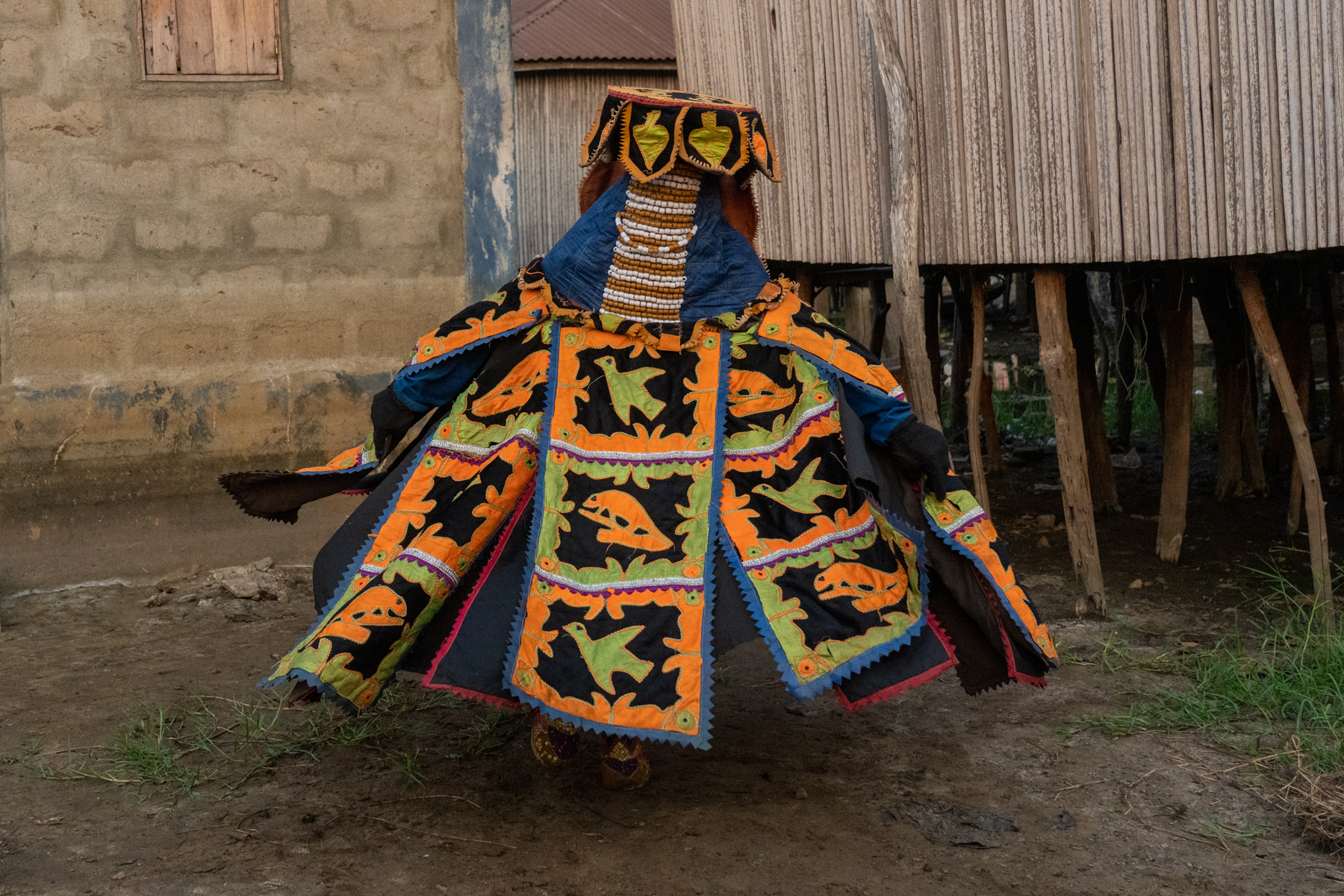 Before terrorising the local Tofinu kids an Egungun twirls to prepare for the chase in Ganvié (image by Inger Vandyke)