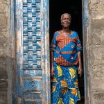 An elderly lady at home in a remote fishing village on the border of Benin and Nigeria (image by Inger Vandyke)