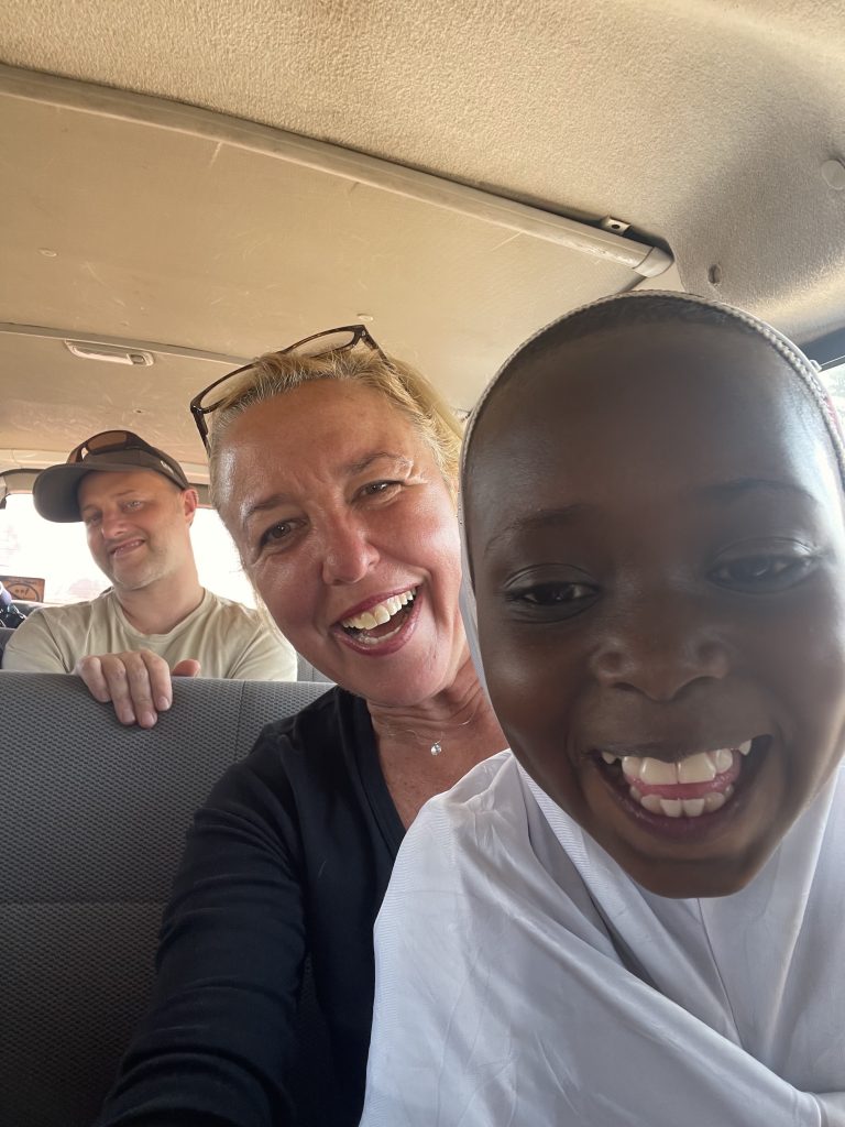Selfie with a Fulani little girl. We gave her and her mum a lift from the market to a village (image by Inger Vandyke)