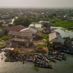 Although the city is rapidly being developed there is still no potable water in Ganvié, so its residents must fetch water to their homes by canoe from a central pumping station (image by Inger Vandyke)