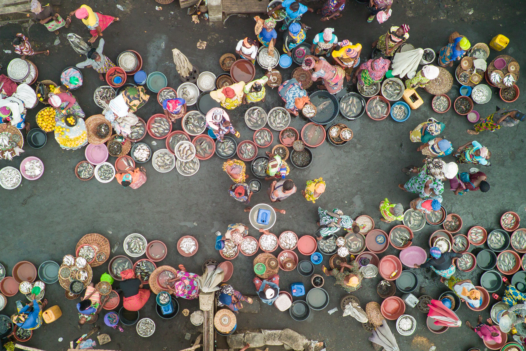 The brightly coloured fish market at the edge of Lake Nokué (image by Inger Vandyke)