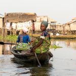 A beautiful Tofinu girl heads to her home in Ganvié (image by Inger Vandyke)