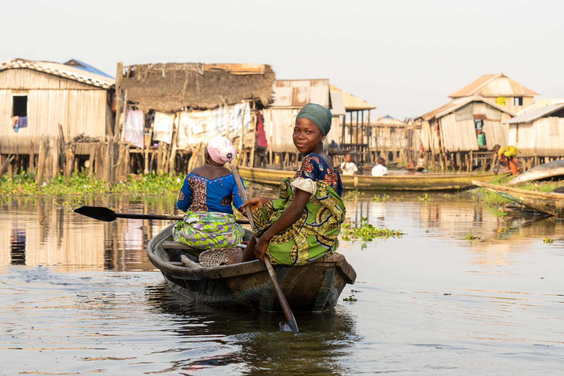 A beautiful Tofinu girl heads to her home in Ganvié (image by Inger Vandyke)