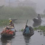 Combine a Harmattan wind with the lake temperature differential and a thick fog shrouds the city of Ganvié, the 'Venice of West Africa' (image by Inger Vandyke)