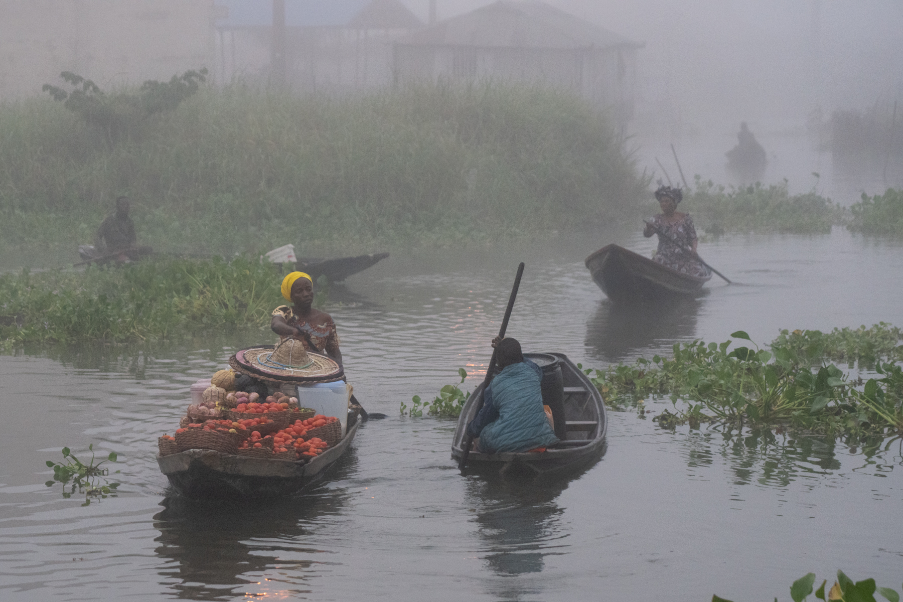 Combine a Harmattan wind with the lake temperature differential and a thick fog shrouds the city of Ganvié, the 'Venice of West Africa' (image by Inger Vandyke)