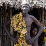 One of the Holi elders prepares to greet us and welcome us to his village (image by Inger Vandyke)