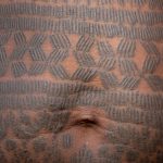 Detail of the ancient practice of tattooing in Holi people. This has largely been abandoned now and only elders of the Holi people carry these beautiful marks (image by Inger Vandyke)