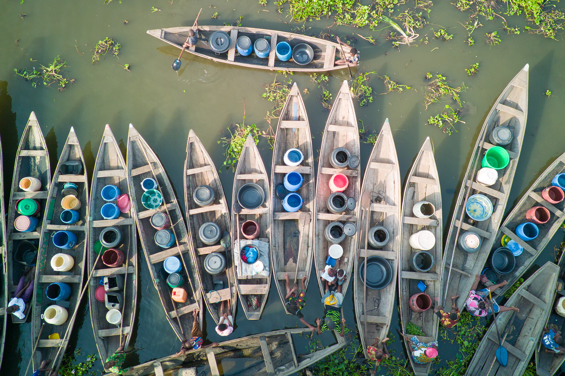 Wooden canoes moored up in the queue to get fresh drinking water at Ganvié (image by Inger Vandyke)