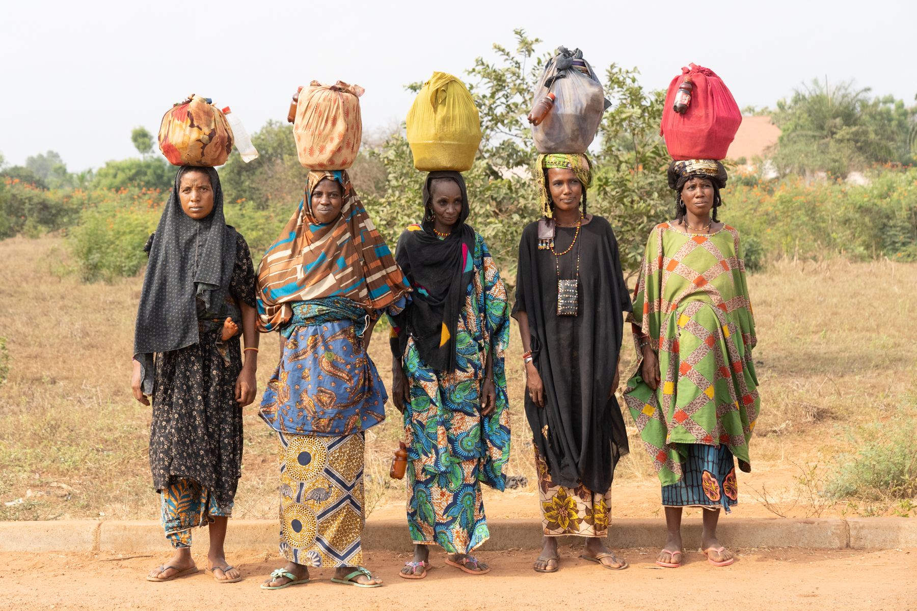 A group of Fulani women walking the roads of Benin to sell traditional medicines (image by Inger Vandyke)