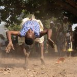 The dancers of Sakpata twirl and somersault energetically during the ceremony (image by Inger Vandyke)