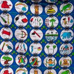 Local West African fabric depicting the various ceremonies of voodoo (image by Inger Vandyke)