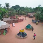 As dusk falls on a remote Beninese village, Zangbetos twirl in to patrol the night and warn the people of evil spirits (image by Inger Vandyke)