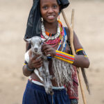 Portrait of a young Arbore girl with her goat kid (image by Inger Vandyke)