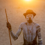A backlit Karo head man returns from herding his livestock (image by Inger Vandyke)
