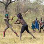 Suri warriors fighting Donga, or a stick fight, designed to settle local disputes between rival clans (image by Inger Vandyke)