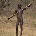 A young Suri man prepares to enter the arena of a Donga stick fight (image by Inger Vandyke)