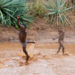 Young Hamer kids take advantage of the flash flood to have a swim (image by Inger Vandyke)