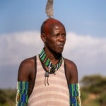 After Hamer men have completed a successful hunt they decorate their hair with feathers and red ochre (image by Inger Vandyke)