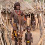 A beautiful Hamer woman and her children in a remote village of southern Ethiopia (image by Inger Vandyke)
