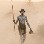 Portrait of a Karo elder herding his livestock in the dust of sunrise (image by Inger Vandyke)