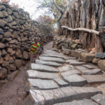Large flat stones are laid out as a waiting area for guests visiting the elders of a Konso village (image by Inger Vandyke)