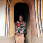 Portrait of a Maji woman in the doorway of her home (image by Inger Vandyke)