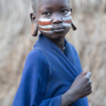 A young Mursi girl with face paint (image by Inger Vandyke)