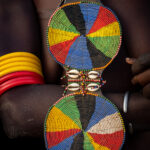 The pretty disc necklaces worn by Nyangatom women (image by Inger Vandyke)