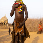 A Nyangatom woman breaks into a spontaneous dance during our visit. It was so beautiful! (image by Inger Vandyke)
