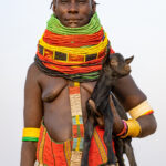 Portrait of a proud Nyangatom woman with her goat kid (image by Inger Vandyke)