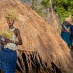 At sunrise a group of Suri girls wait to be photographed. It's sometimes impossible NOT to photograph these people, they are so beautiful (image by Inger Vandyke)