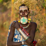 A stunning Suri woman with her lip disc in our sunrise photo shoot (image by Inger Vandyke)