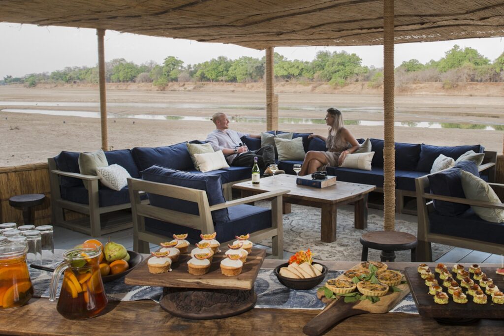 Kaingo's wonderful pontoon lounge where you can dine at water level with some of South Luangwa's amazing river wildlife (image by Kaingo Camp)